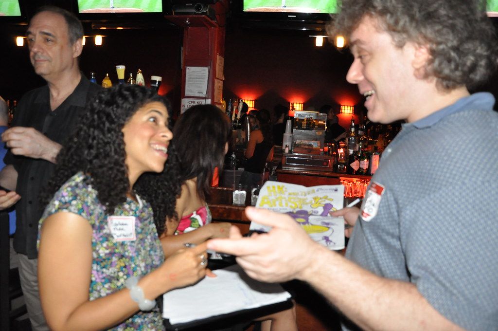 People in conversation at an evening networking event